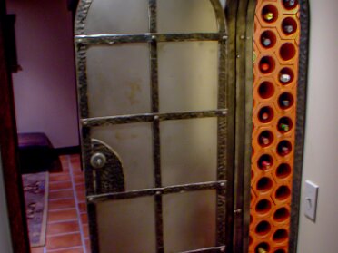 V- Wine Door The door was designed to the space. We started with a frame and then built the door to fit the frame. The door itself is...